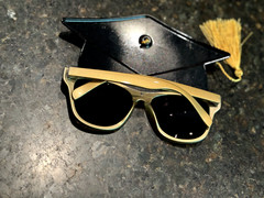 Graduation Bundle: Centerpiece, Confetti, Glasses, Stickers, Toy Duck, And Bag