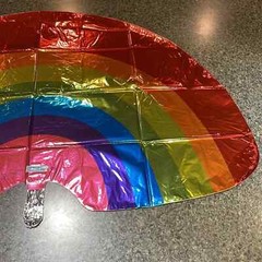 Rainbow shape 32” Mylar balloon multi color. New in plastic never opened