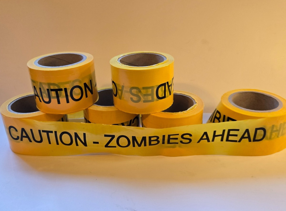 CAUTION ZOMBIES! Halloween Warning Tape Banner – 250+ feet long!
