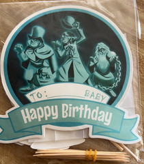Disney’s Haunted Mansion Birthday Party Pack – Banner, 12 Cupcake Picks & Topper