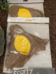 Lemon first birthday decor, garland, paper fans, fake lemons, limes & lemon tree