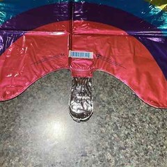 Rainbow shape 32” Mylar balloon multi color. New in plastic never opened