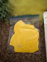 Lemon first birthday decor, garland, paper fans, fake lemons, limes & lemon tree