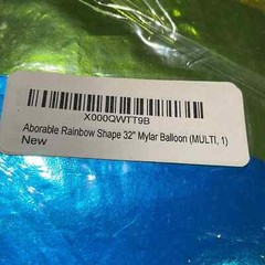 Rainbow shape 32” Mylar balloon multi color. New in plastic never opened