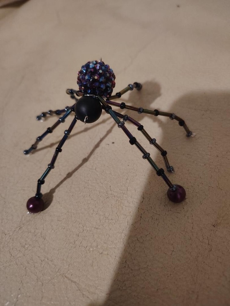 Purple and black beaded spider.