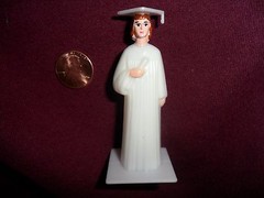 Vintage Plastic Girl Graduate in White Cap and Gown Holding Diploma