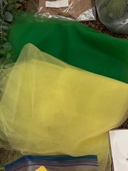 Lemon first birthday decor, garland, paper fans, fake lemons, limes & lemon tree