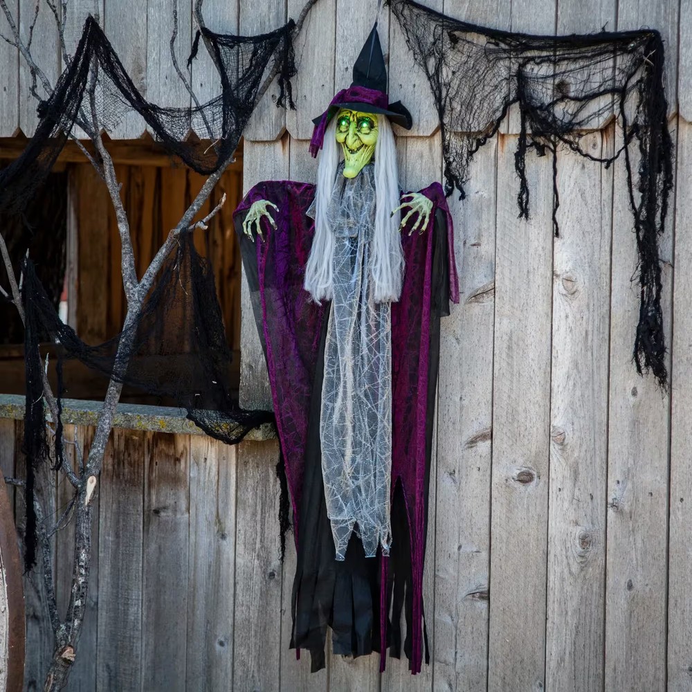 Morris Costumes 4 ft Hanging Animated Witch with Green Eyes Decoration – Black