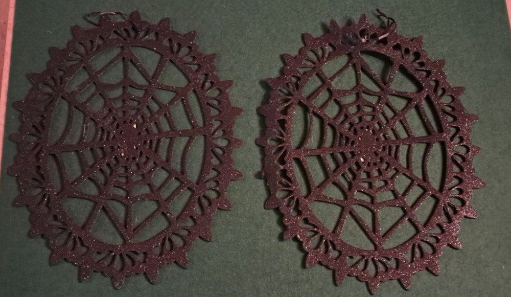 Sparkly Hanging Halloween decorations. Black cobwebs and Gold witches.