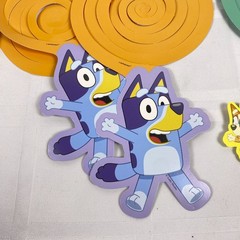Bluey Customizable Banner. Added in 11 spiral hanging deco pieces